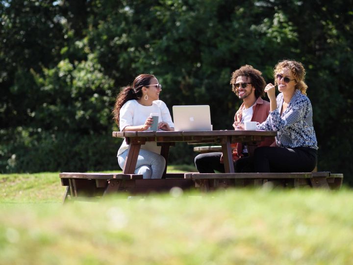 Three persons in a park
