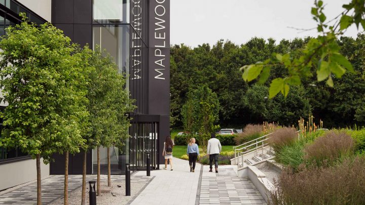 people next to maplewood building