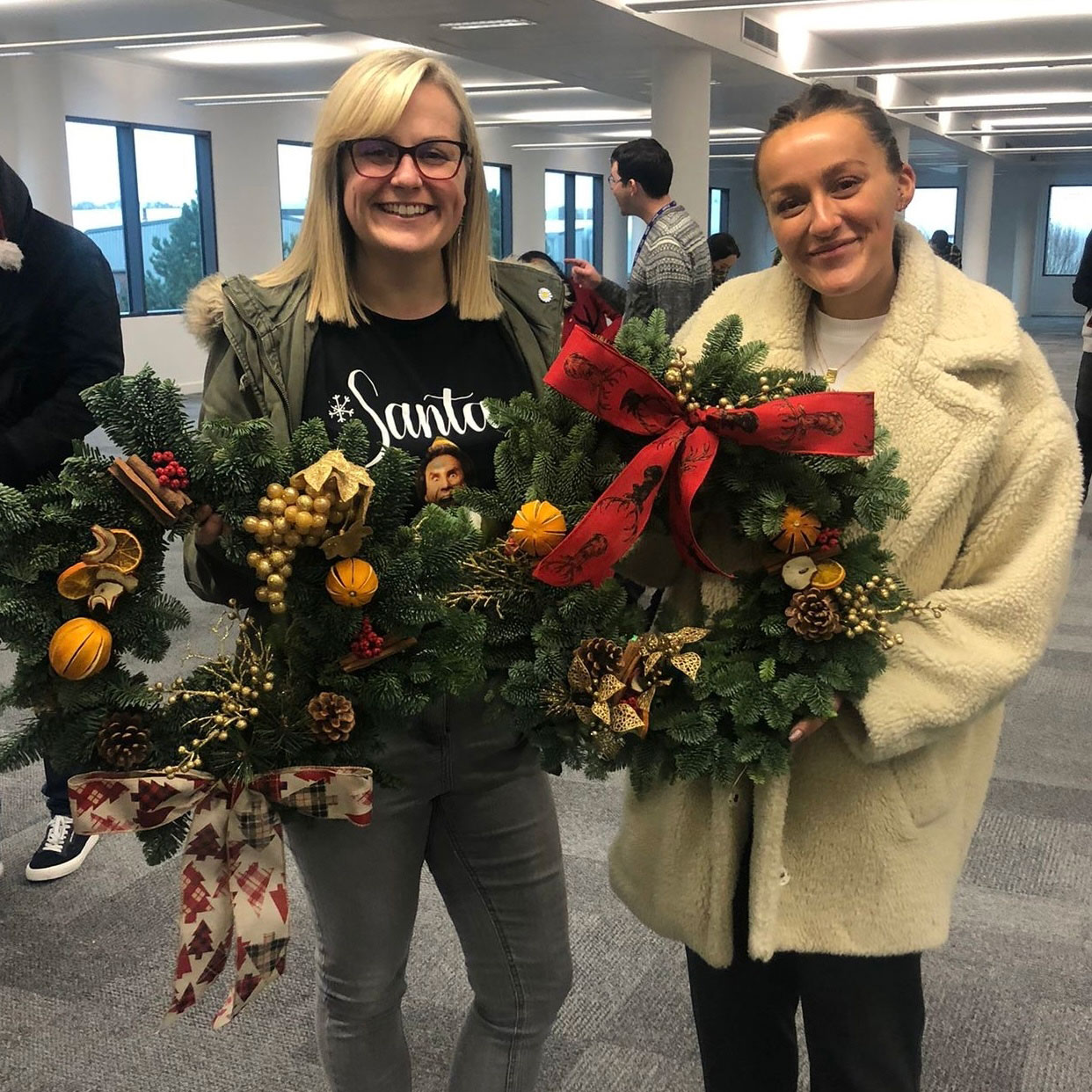 santa two people raise money christmas