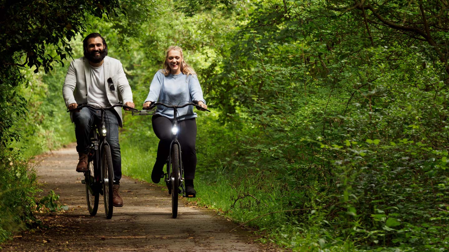 two people cycling