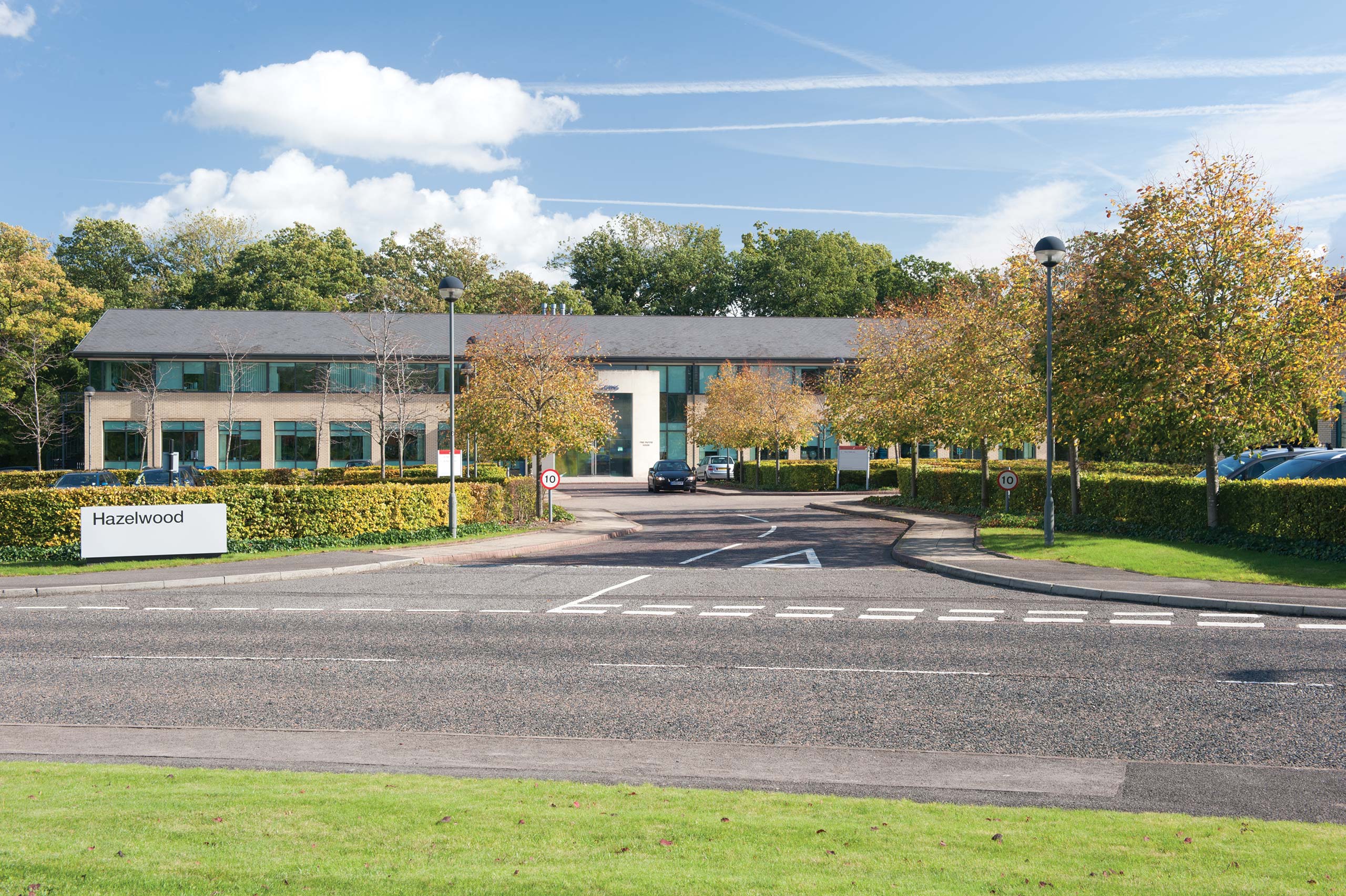 An office building with a street in front of it.