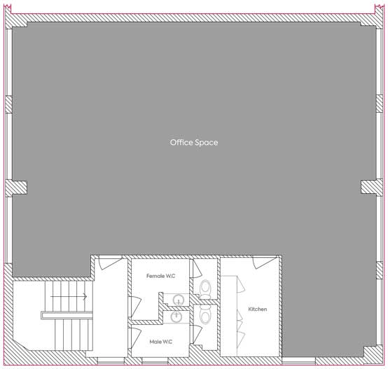 Floor plan of an office space with labeled areas for a kitchen, a male wc, and a female wc, showing structural details and room divisions.
